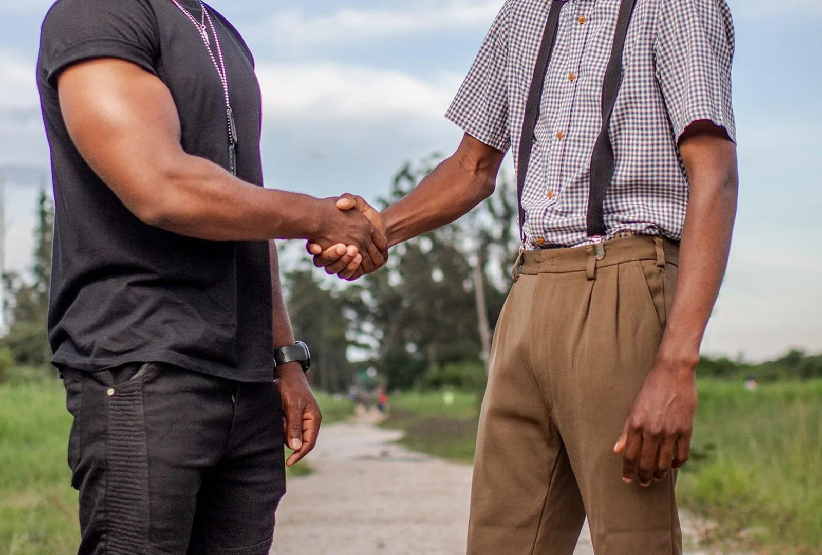 Two members shaking hands in agreement